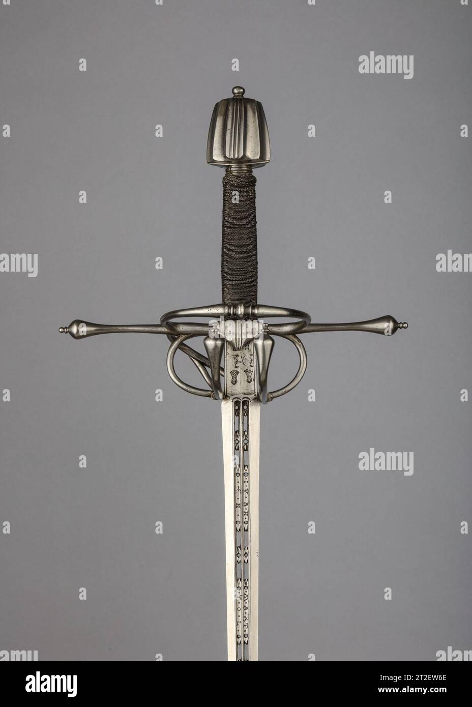 Rapier Bladesmith Juan Martinez the Elder Spanish mid-16th century The rapier was the principal civilian sidearm throughout the sixteenth and seventeenth centuries. Designed for cut-and-thrust fencing of progressively complex techniques, the rapier is characterized by a double-edged blade with an acute point and an elaborate guard for the hand. The guards, usually of iron or steel, were subject to a variety of embellishment. They were engraved, chiseled, gilded, damascened, and encrusted in gold and silver in keeping with fashionable styles. Unless otherwise noted, the materials, attributions, Stock Photo