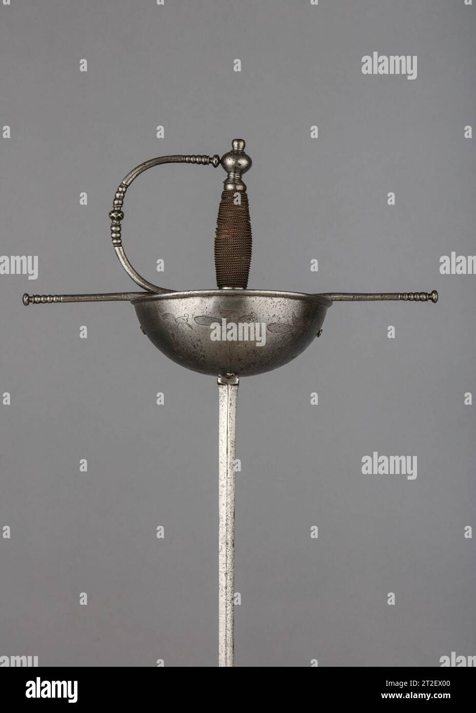 Cup-Hilted Rapier Spanish 17th century The rapier was the principal civilian sidearm throughout the sixteenth and seventeenth centuries. Designed for cut-and-thrust fencing of progressively complex techniques, the rapier is characterized by a double-edged blade with an acute point and an elaborate guard for the hand. The guards, usually of iron or steel, were subject to a variety of embellishment. They were engraved, chiseled, gilded, damascened, and encrusted in gold and silver in keeping with fashionable styles. Unless otherwise noted, the materials, attributions, and dating given here refer Stock Photo