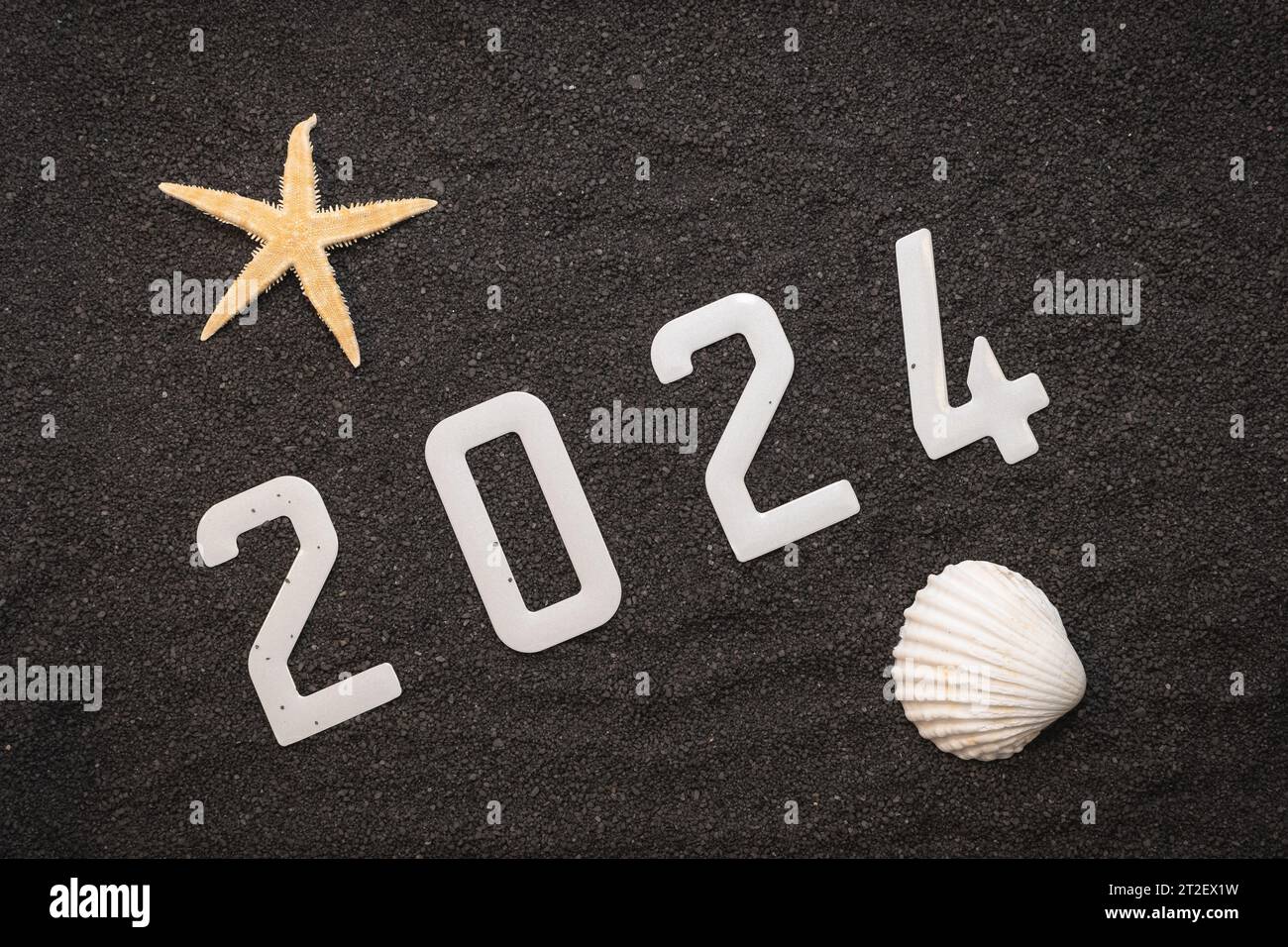 Happy New Year 2025 New Year 2025 concept on the black sand of a beach