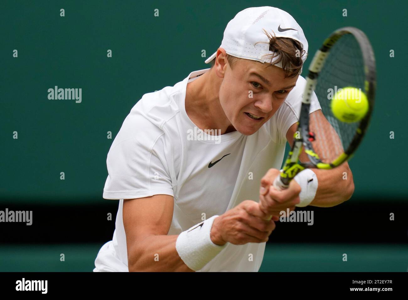 FILE - Denmark's Holger Rune returns in a men's singles match on day ...