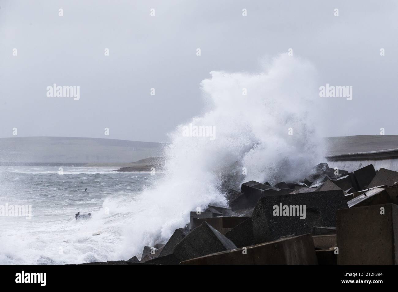 Orkney, UK. 19th Oct, 2023. UK WEATHER: Storm Babet hits Orkney with gale force winds as the Met Office put out a yellow weather warning for the north east of Scotland. High winds cause waves to crash over the A961 which crosses one of the Churchill Barriers on the islands. Credit: Peter Lopeman/Alamy Live News Stock Photo