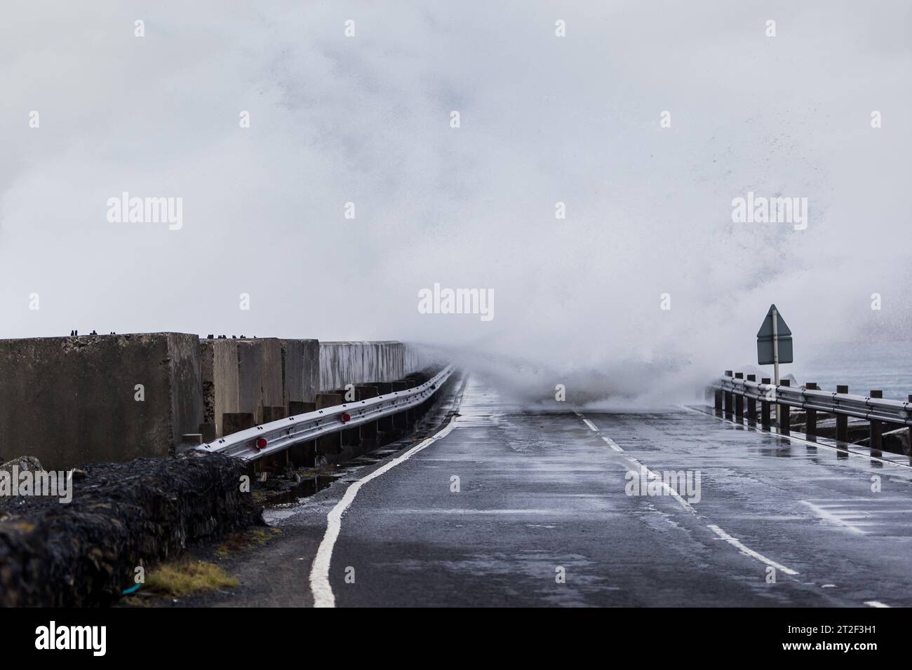 Orkney, UK. 19th Oct, 2023. UK WEATHER: Storm Babet hits Orkney with gale force winds as the Met Office put out a yellow weather warning for the north east of Scotland. High winds cause waves to crash over the A961 which crosses one of the Churchill Barriers on the islands. Credit: Peter Lopeman/Alamy Live News Stock Photo