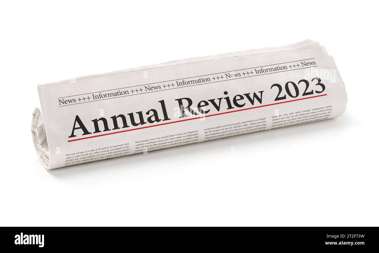 Rolled newspaper with the headline Annual review 2023 Stock Photo