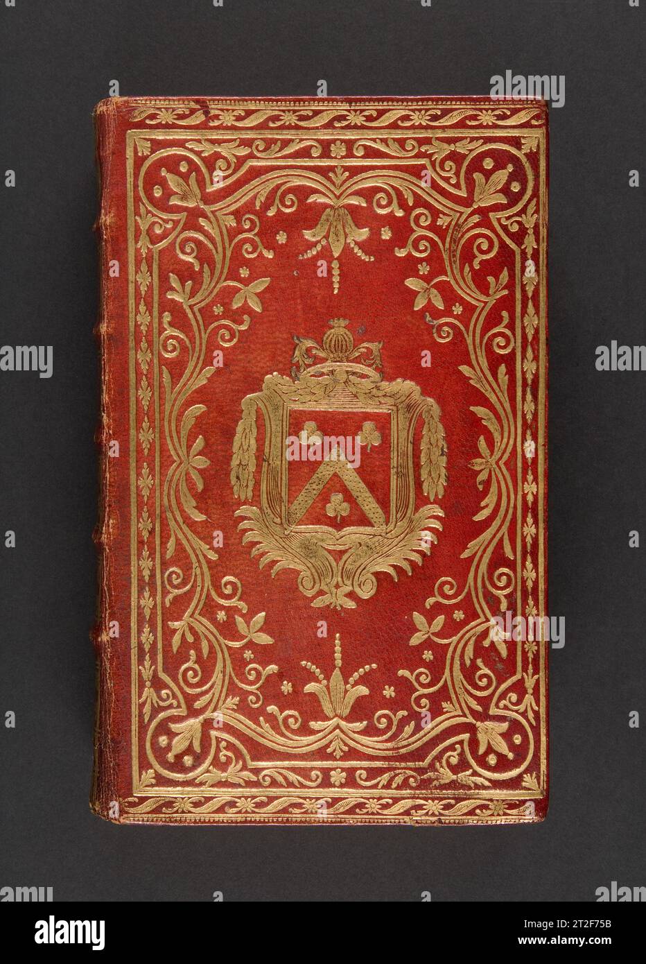 Almanach royal, année bissextile M.DCC.LXXXVIII, présenté a sa Majeste pour la premiere fois en 1699 Publisher Laurent Charles d' Houry French 1787 Bound in an armorial binding with the coat of arms of Claude Barthelot, marquis de Rambuteau. The binding is covered in full red morocco, gold-tooled on both covers, spine and board edges. The coat of arms of Claude Barthelot, marquis de Rambuteau, is tooled in the center of the identical covers. The arms are surrounded with undulating floral designs, bordered by linear decorative motifs. Stock Photo