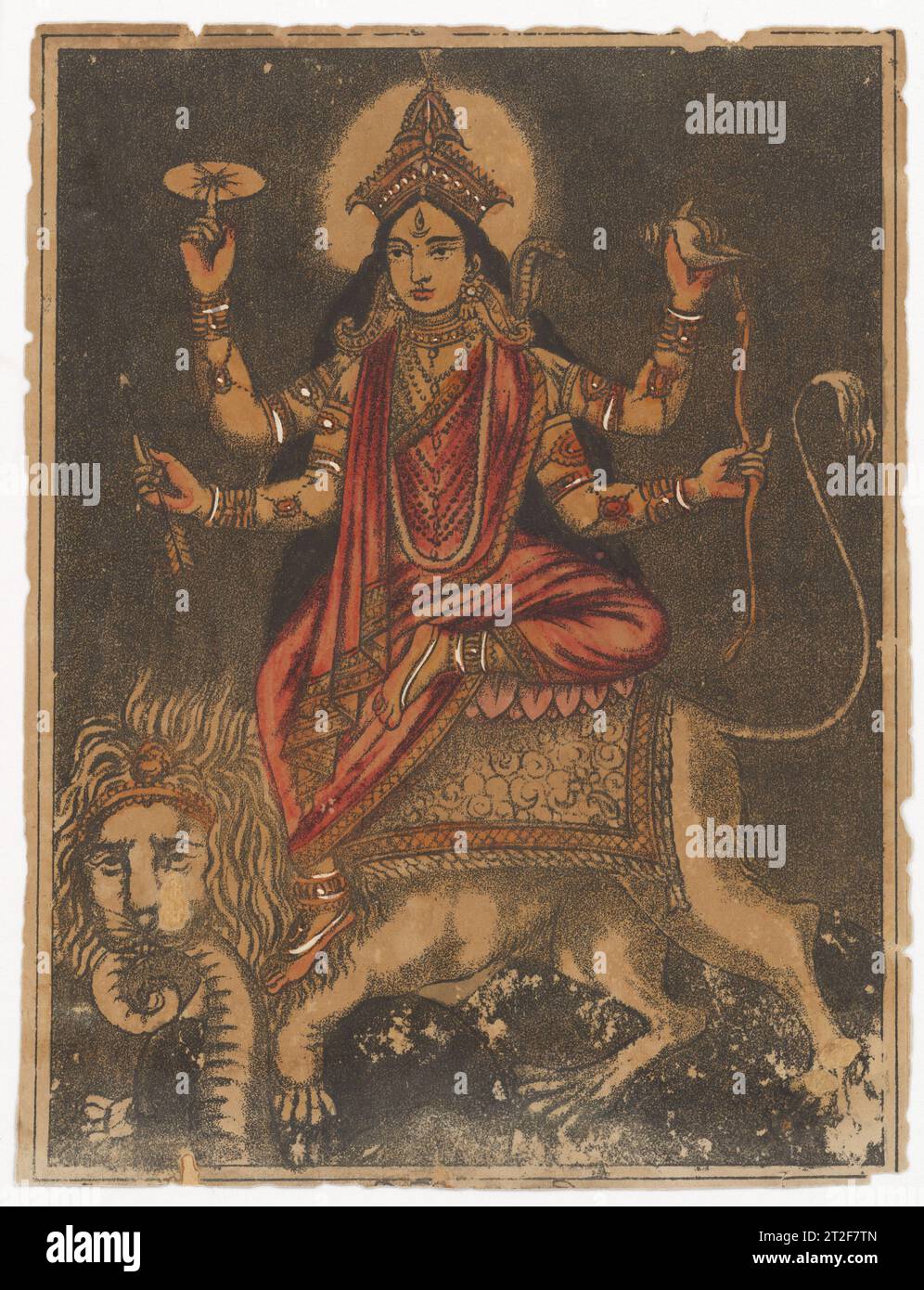 Goddess Jagadhatri West Bengal, Calcutta ca. 1870–80 Jagadhatri represents an aspect of the Hindu goddess Durga (Parvati) widely worshipped in West Bengal and Odisha, and most lavishly in the annual puja held in the Hooghly district of Kolkata, celebrated in the month of Kartik (mid-November). The goddess rides a lion which has slain an elephant—visible between the lion’s forelegs—while it holds the trunk in its jaws. She is dressed in red and seen in four-armed form, displaying a discus and conch in her upper hands (acknowledging Vishnu) and a bow and arrow in her lower hands. A third eye in Stock Photo