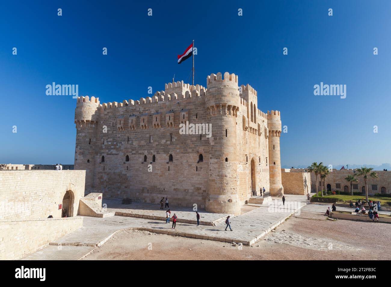 Alexandria, Egypt - December 14, 2018: People are near The Citadel of Qaitbay or the Fort of Qaitbay, this is a 15th-century defensive fortress locate Stock Photo