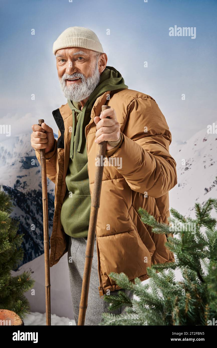 athletic Santa in warm comfy outfit standing on skis and smiling at camera, Christmas concept Stock Photo