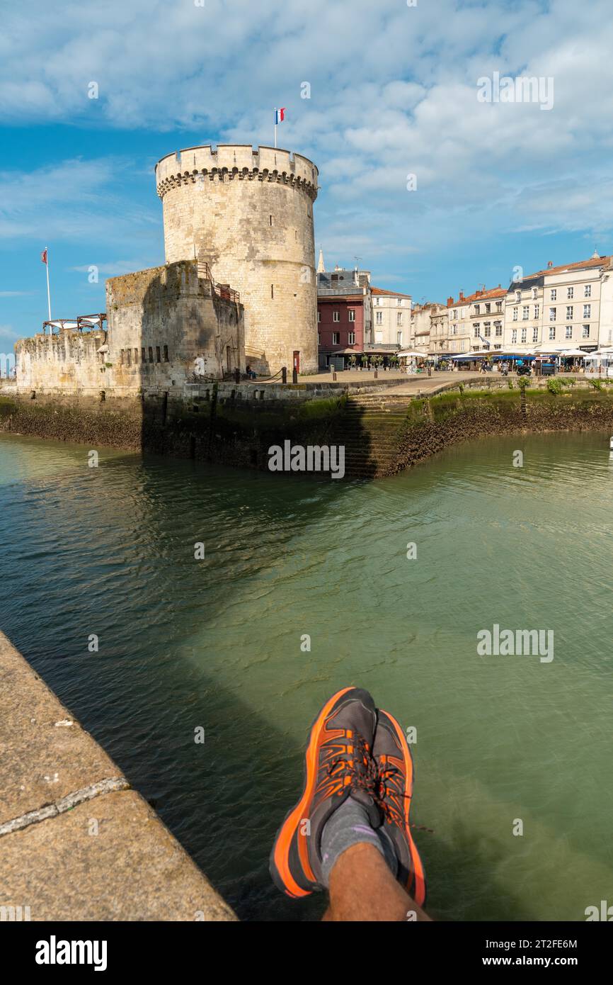 Resting next to The Chain Tower of La Rochelle. Coastal town in southwestern France Stock Photo