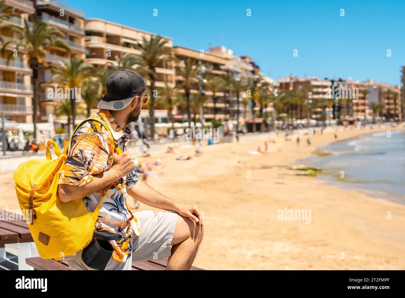 A young foreign tourist at Playa del Cura in the coastal city of Torrevieja, Alicante, Valencian Community. Spain, Mediterranean Sea Stock Photo