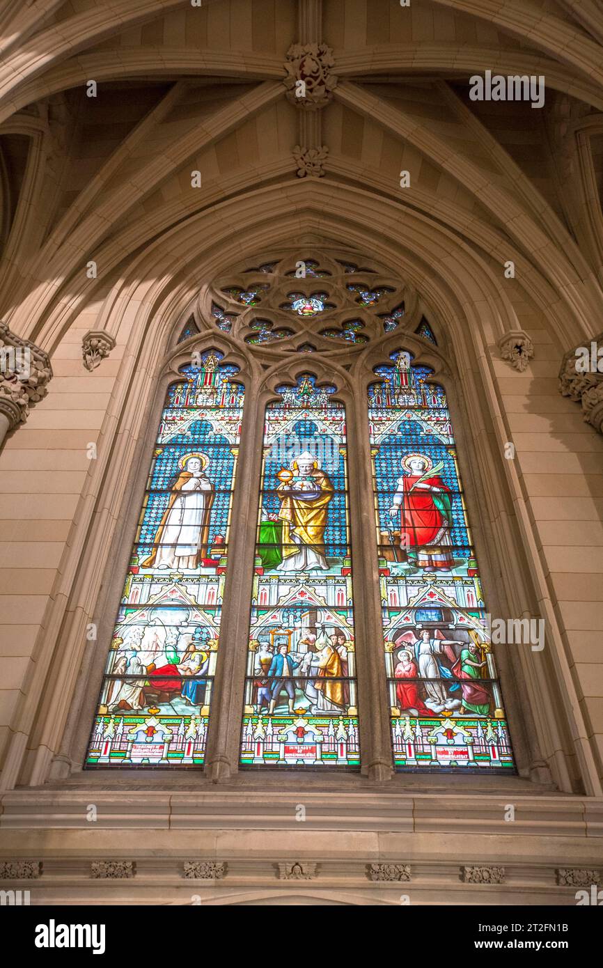 New York, United States Â», January 5, 2020: Stained glass window in St. Patrick's Cathedral is a decorated neo-Gothic Catholic cathedral located in Stock Photo