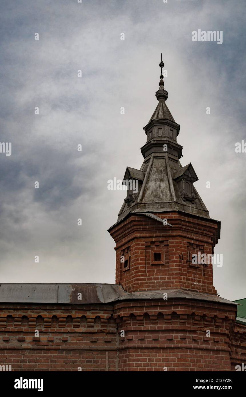 Tower of red brick Trinity Lavra of St. Sergius in cloudy weather Stock Photo