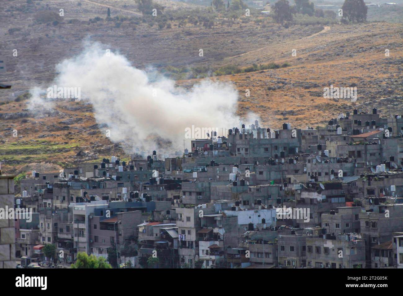 Tulkarm, Palestine. 19th Oct, 2023. Smoke rises from homes and roads during the Israeli storming of the Palestinian city of Tulkarm in the northern West Bank. Credit: SOPA Images Limited/Alamy Live News Stock Photo
