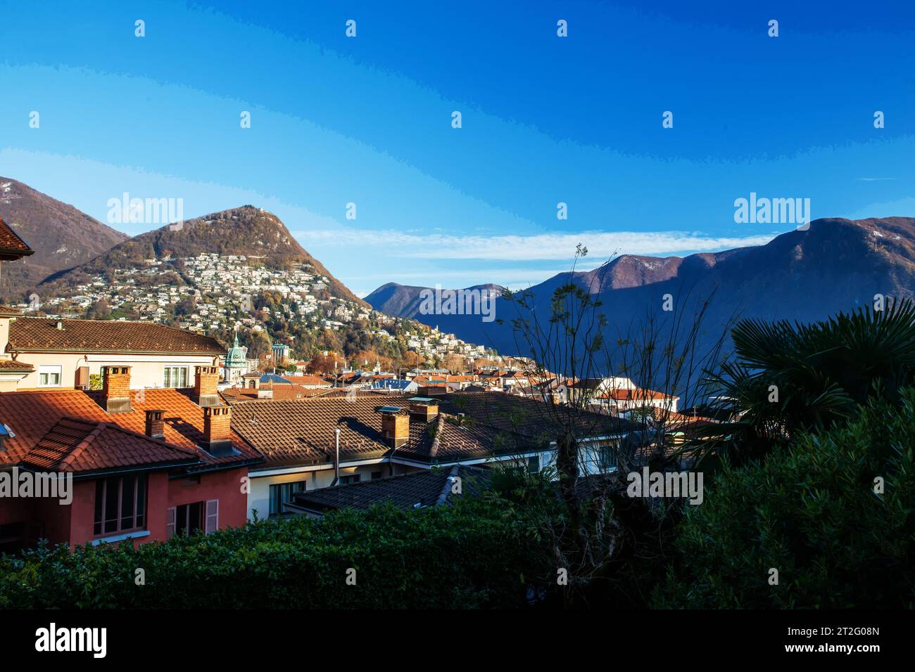 View on Lugano: red roofes and houses in distance from Lugano train ...