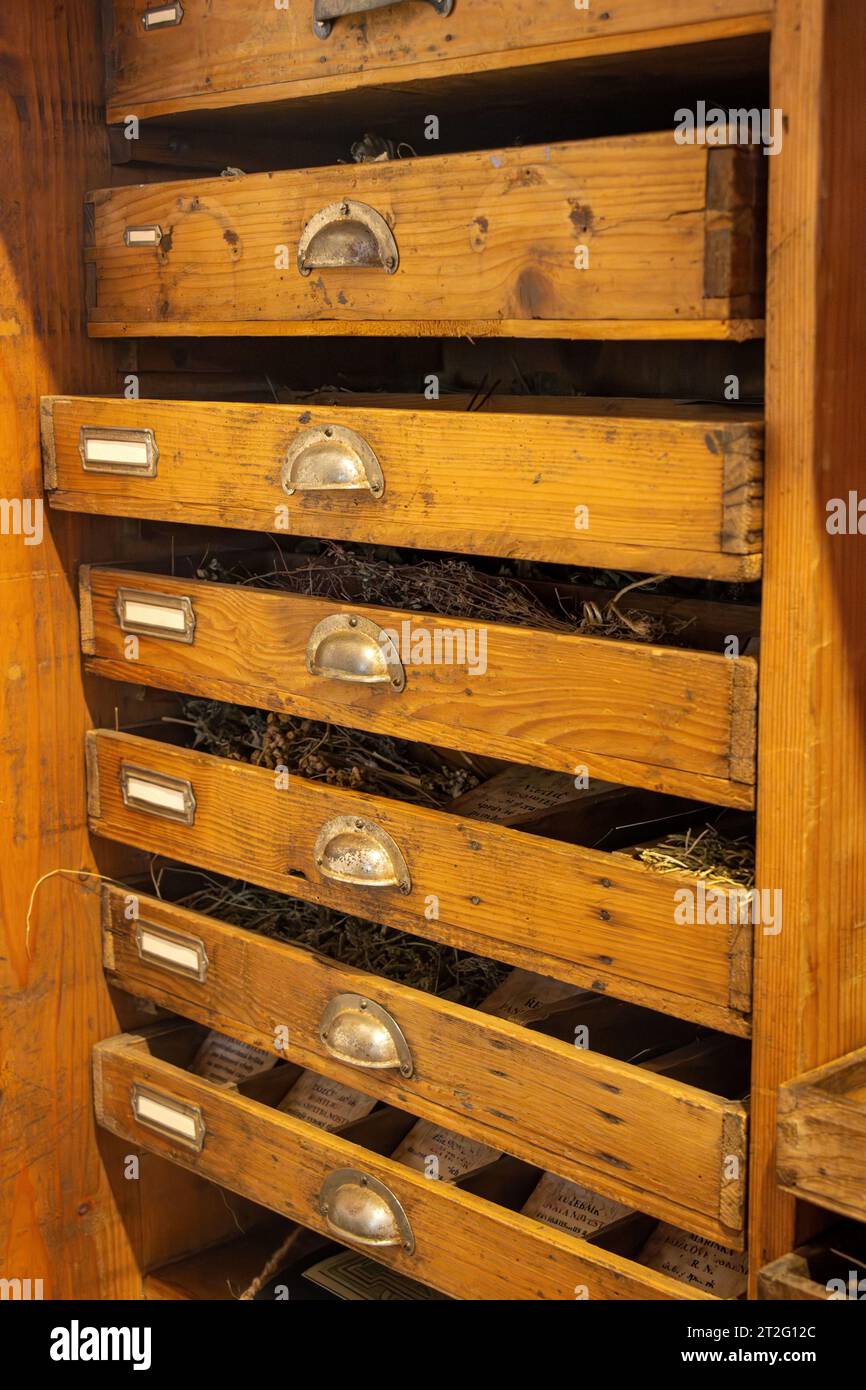 An old cabinet with drawers filled with herbs Stock Photo