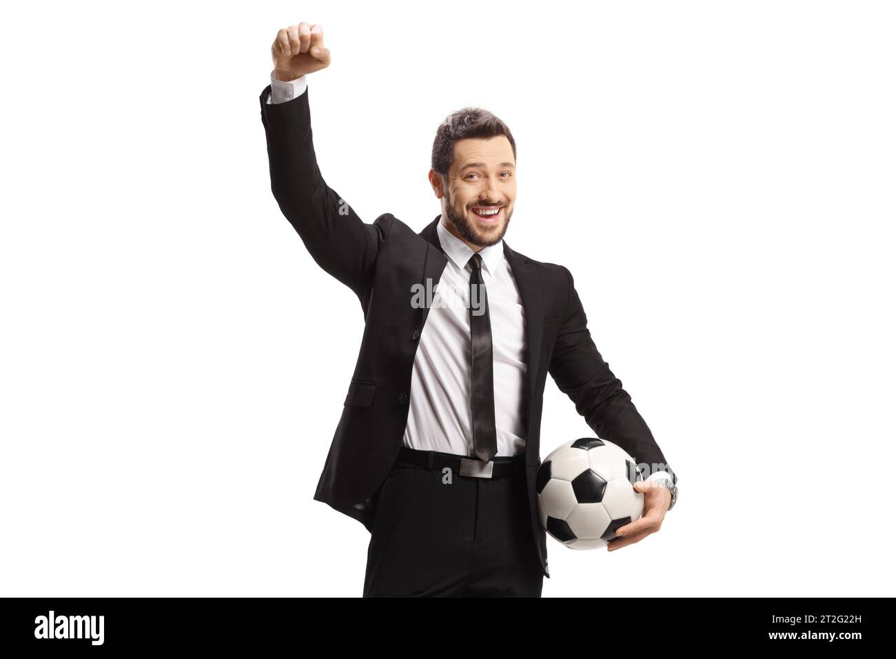 Man in a black suit holding a soccer ball and gesturing happiness ...