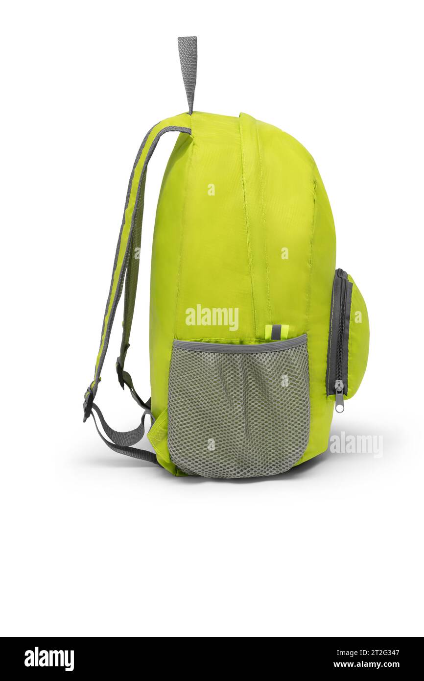 blank green backpack with zipper and shoulder straps isolated on white background. travel daypack rucksack. folding nylon school backpack. side view. Stock Photo