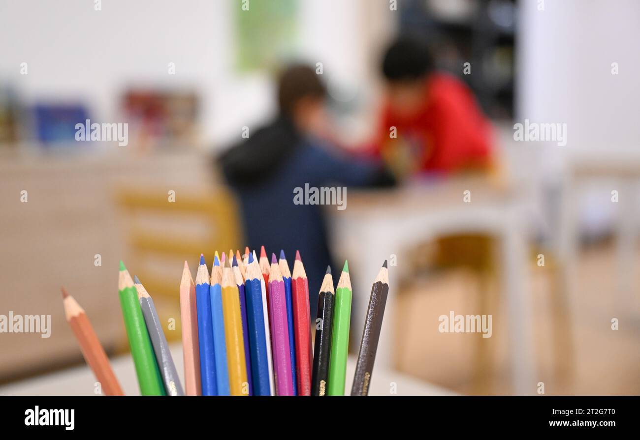Stuttgart, Germany. 17th Oct, 2023. Children do their homework together in the new rooms of the 'Arche' children's charity in Stuttgart. The children's charity offers a fixed and reliable place to go with free lunch, learning support and leisure activities. Credit: Bernd Weißbrod/dpa/Alamy Live News Stock Photo