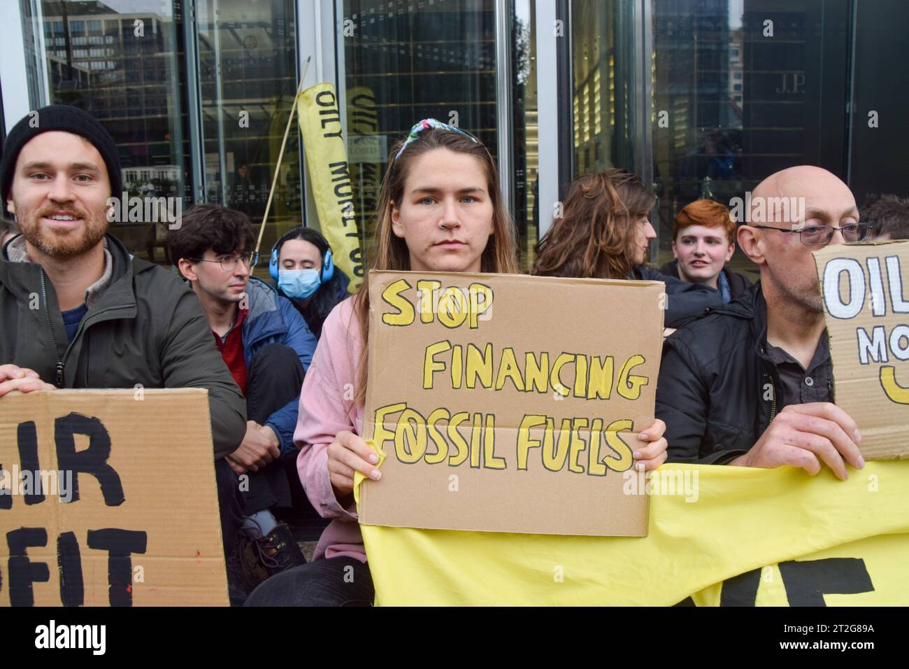 London, UK. 19th Oct, 2023. A protester holds a placard which states