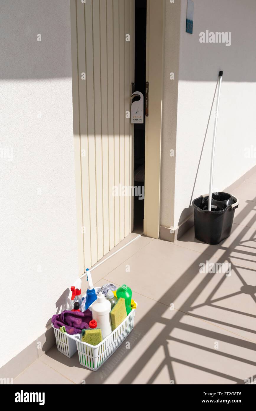 Greece, Europe.  01.10.2023.  Housekeeping equipment for cleaning hotel room placed outside bedroom door Stock Photo