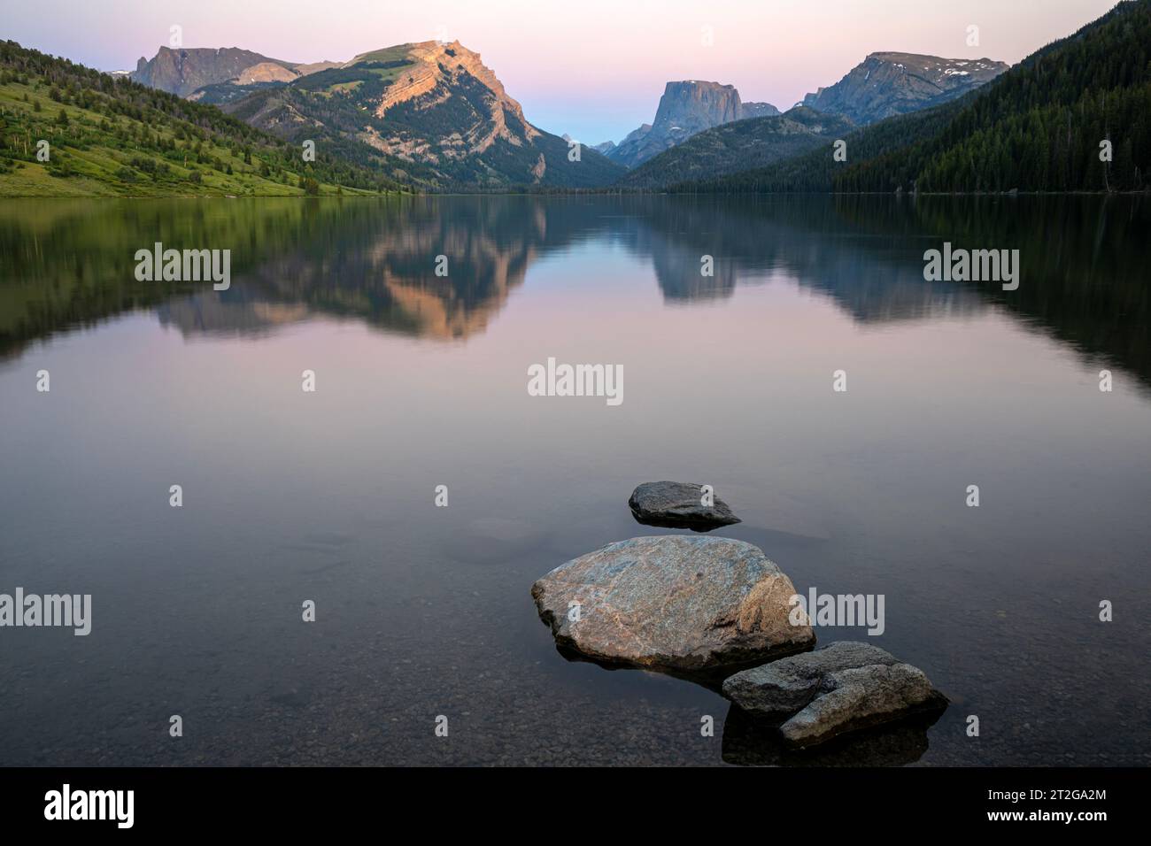 WY05299-00...WYOMING - Rocks along the shore of Green River Lake with Squaretop Mountain in the distance at sunset in Bridger National Forest. Stock Photo
