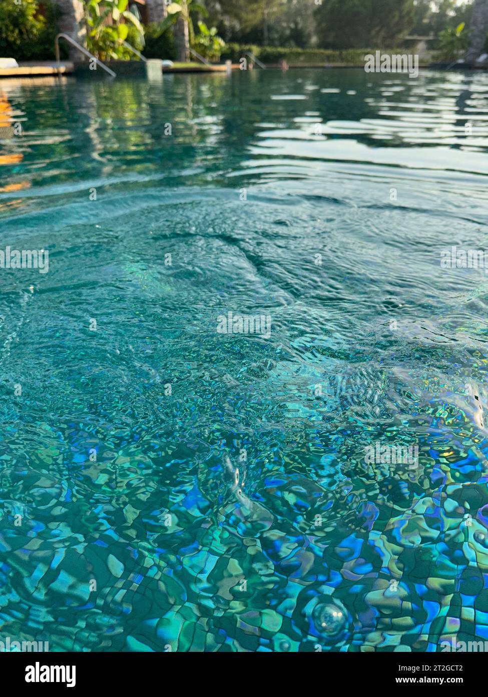 Clear rippled water in outdoor swimming pool Stock Photo