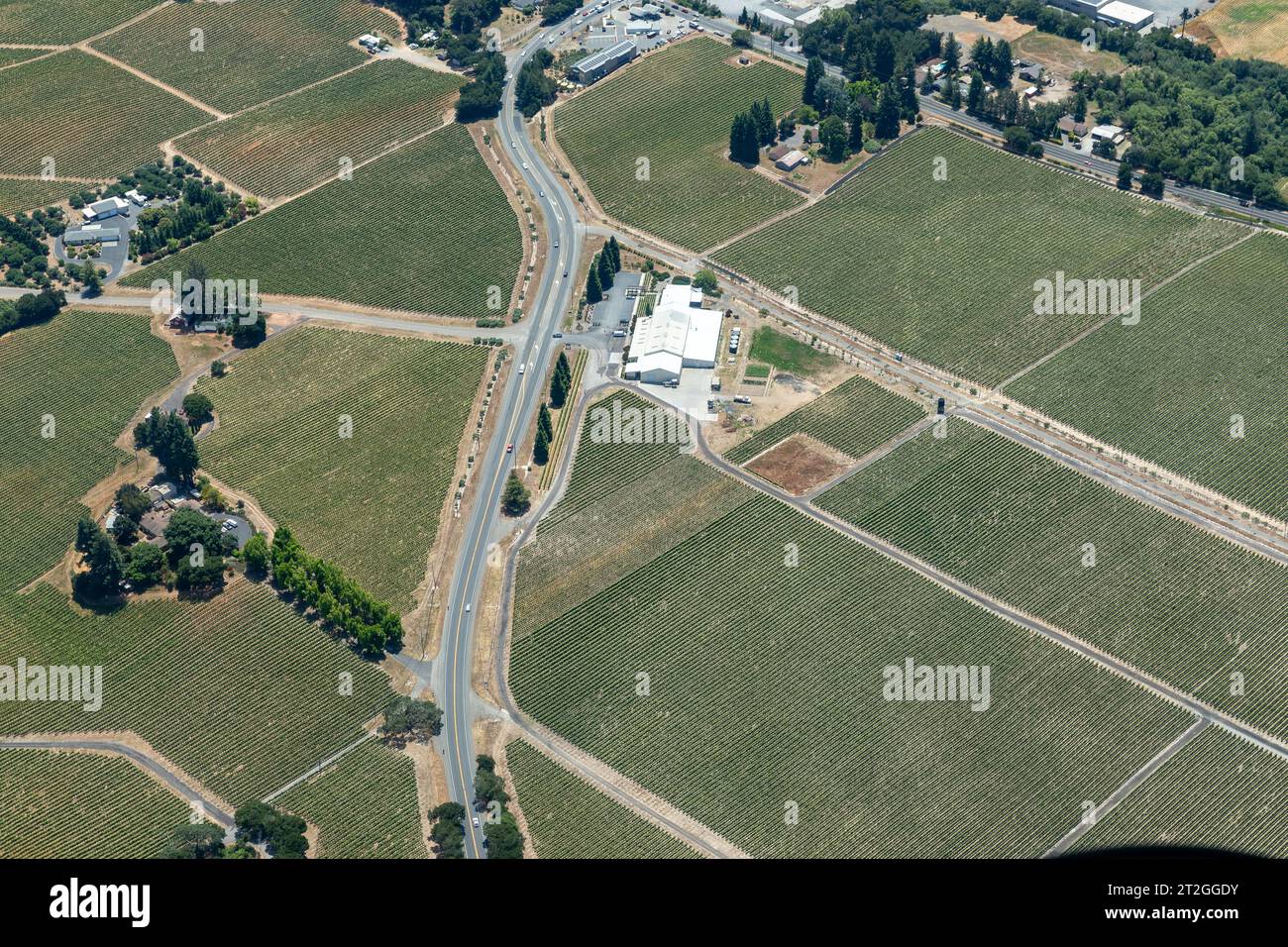Aerial view of roadways crossing the fertile green crops of norther California vineyards Stock Photo