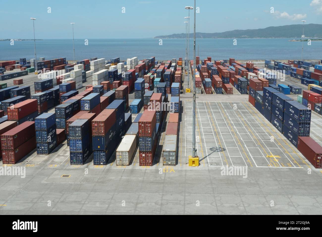Container terminal with boxes from different shippers lined in the Port of Kingston. Stock Photo