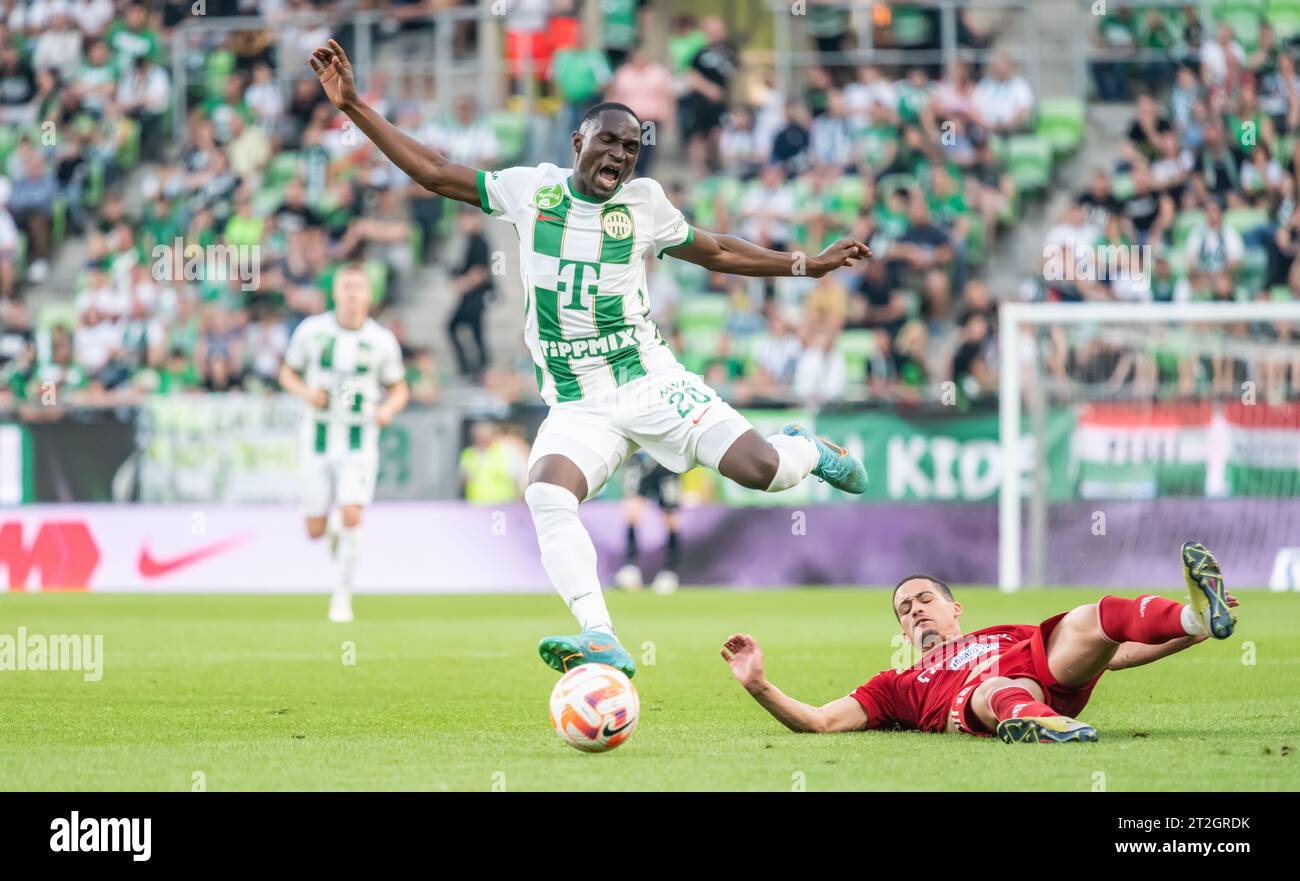 Budapest, Hungary – May 20, 2023. Debrecen left-back Christian Manrique in tackle against Ferencvaros striker Adama Traore during Hungarian OTP Bank L Stock Photo