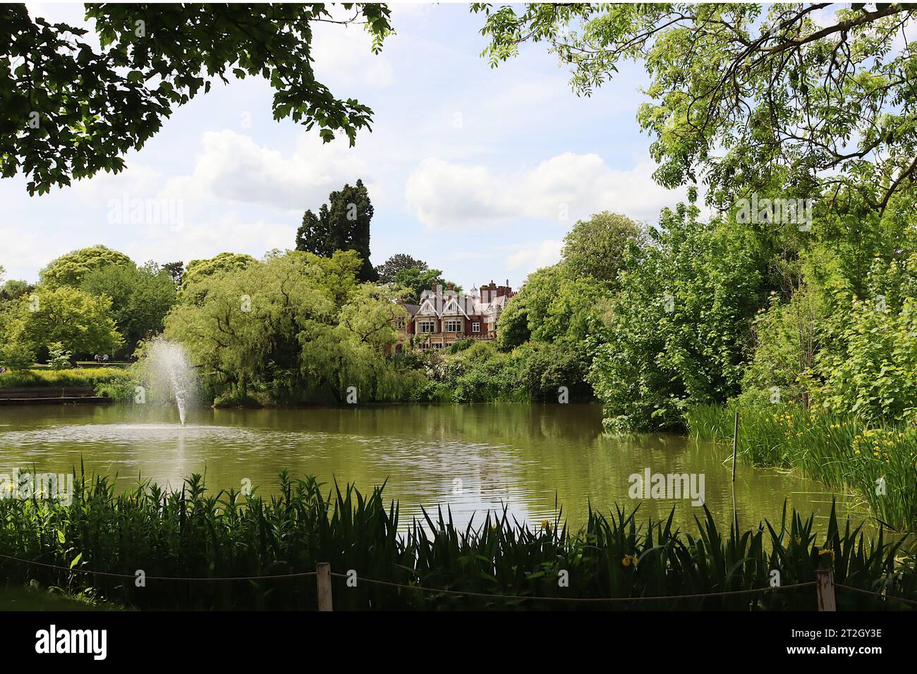 The view of Bletchley Park mansion viewed from the lakeside. In the 1990s it was revealed to have been an undercover WWII code breaking centre. Stock Photo