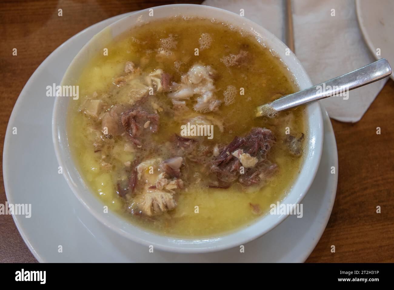 Soup of boiled sheep parts, including, head, brain, feet and stomach. Stock Photo