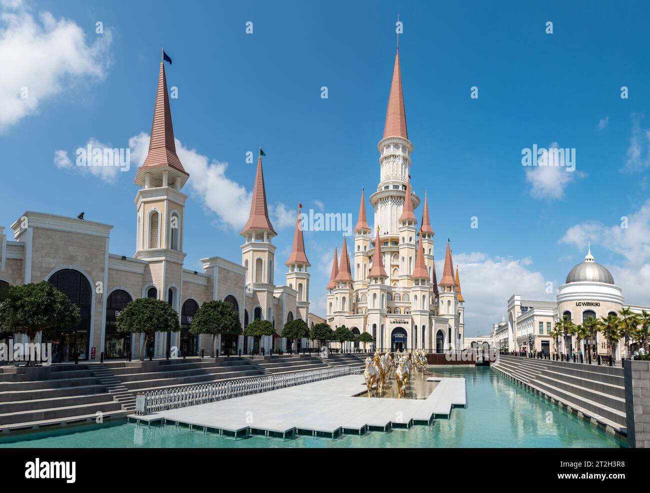 Belek, Antalya, Turkey - March 27, 2023. The Land of Legends theme park in Belek, Turkey. View toward the Chateau building, with a pool and chariot mo Stock Photo
