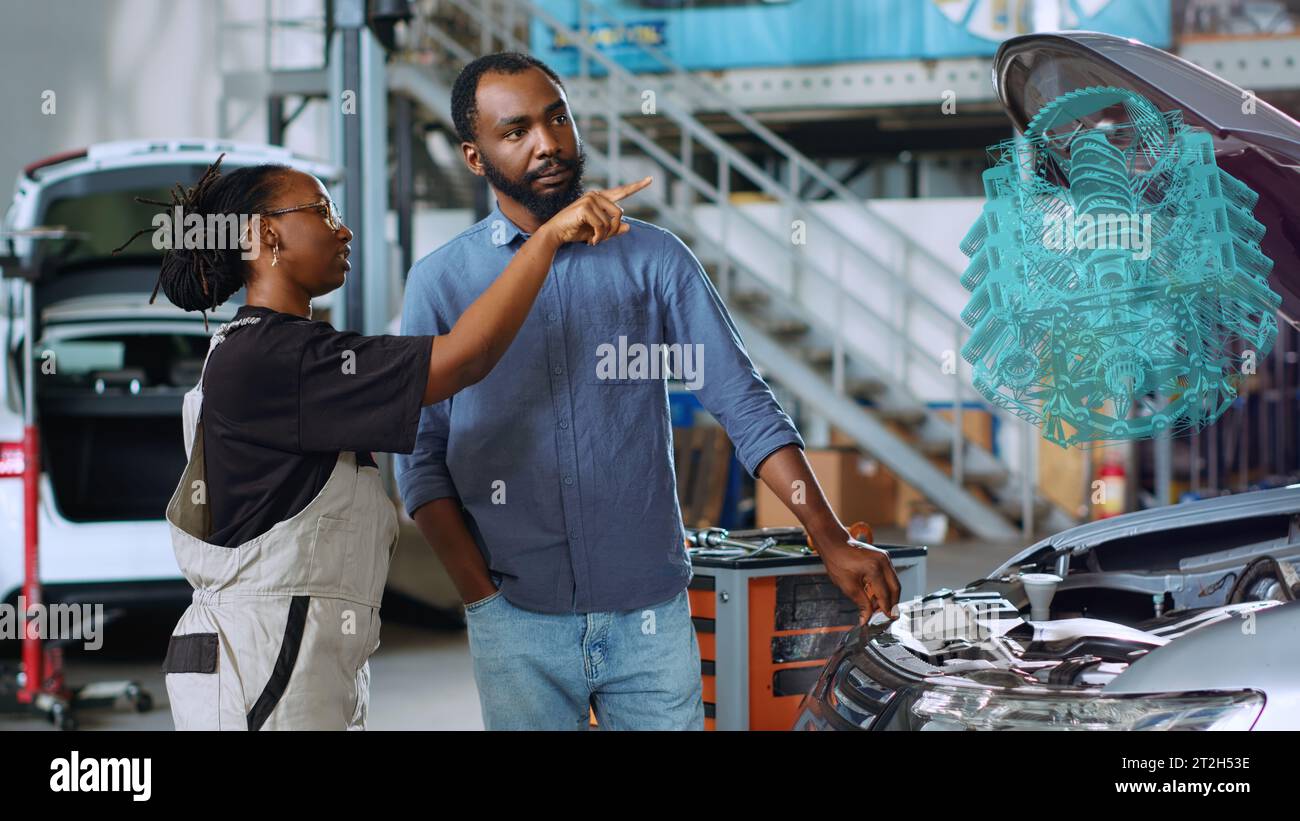 Mechanic in car service using holographic augmented reality to show ...