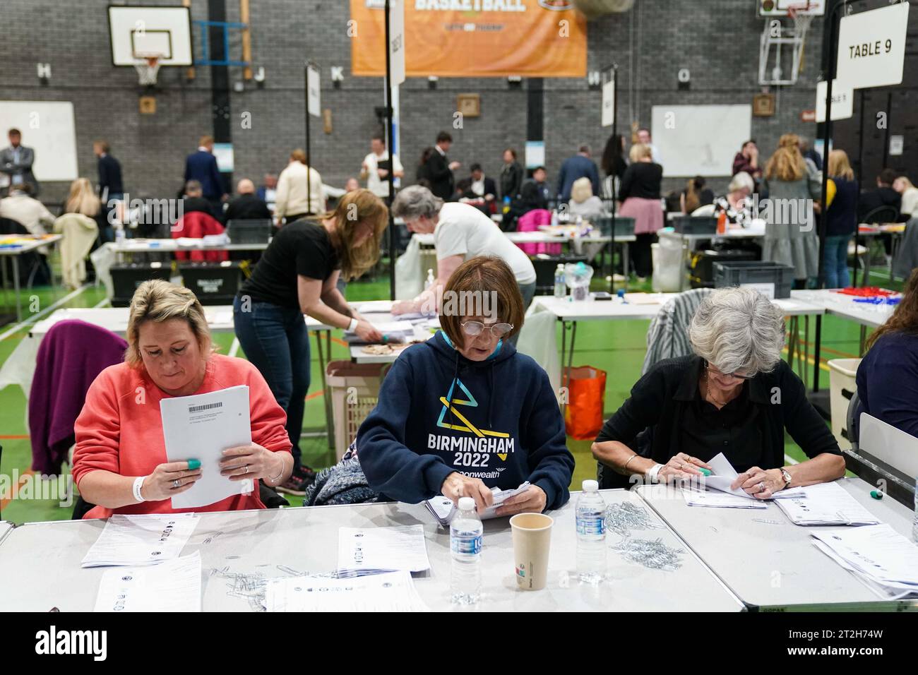 Ballot papers are checked and verified by count staff for the Tamworth by-election at The Rawlett School. Picture date: Thursday October 19, 2023. Stock Photo