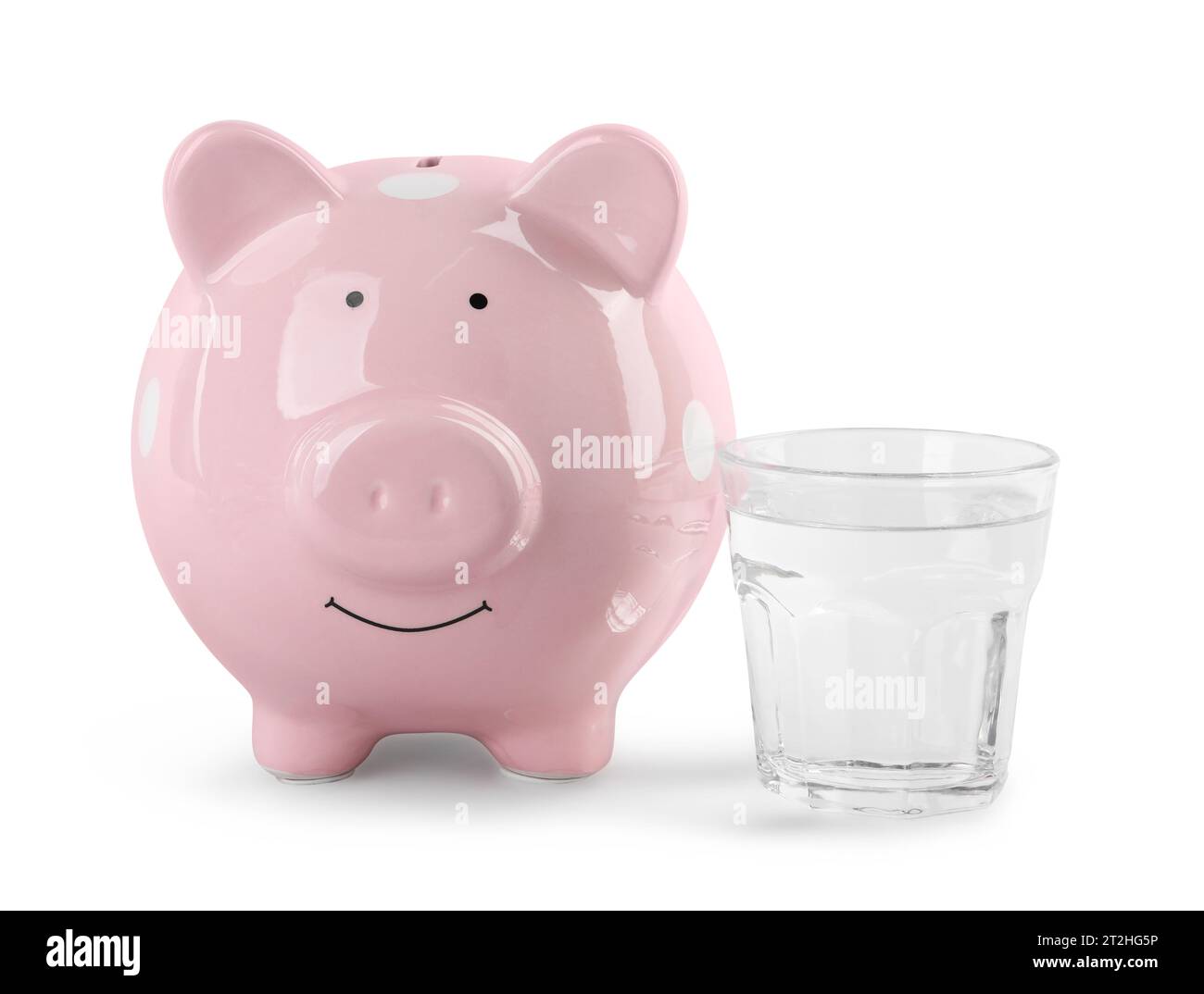 Water scarcity concept. Piggy bank and glass of drink isolated on white Stock Photo