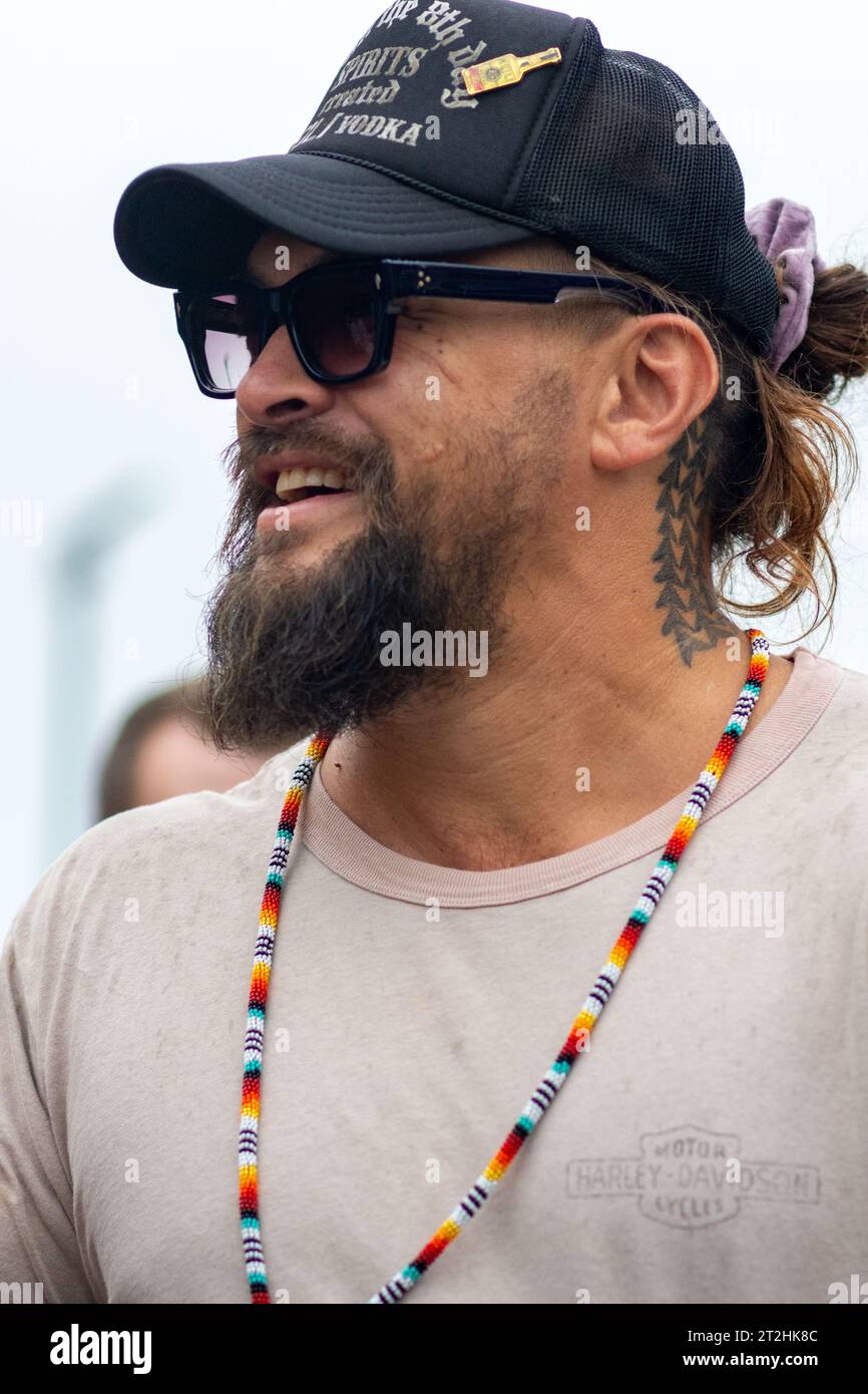 Jason Momoa interacts with the crowd that came out to his bottle signing event promoting his new Meili Vodka.    Photo taken October 19, 2023 in Brook Stock Photo