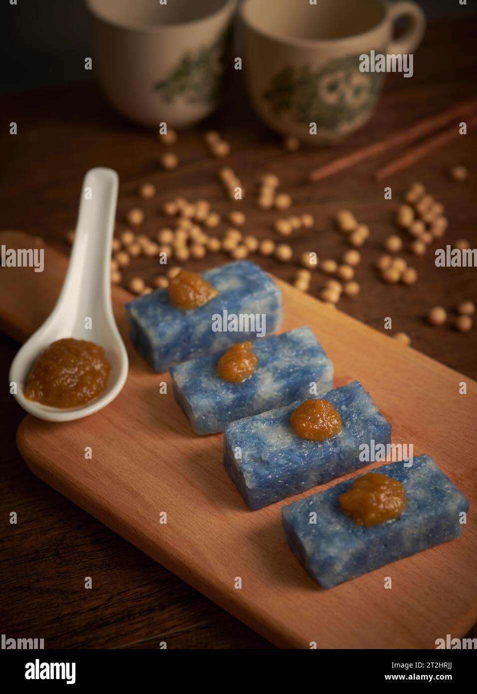 Selective focus image of  Nyonya kuih “Kaya Kuih” (Blue Glutinous Rice Cakes), traditional Malaysian Nyonya sweet cake. Stock Photo