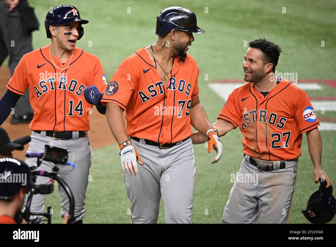 Arlington, United States. 19th Oct, 2023. Houston Astros Jose Abreu celebrates with Jose Altuve and Mauricio Dubon after hitting a three-run home run in the fourth inning to give the Astros a 7-3 lead over the Texas Rangers in game four of the ALCS at Globe Life Field in Arlington, Texas on Thursday, October 19, 2023. Photo by Ian Halperin/UPI. Credit: UPI/Alamy Live News Stock Photo