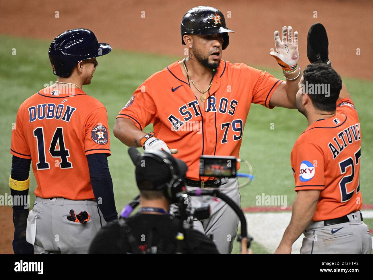 Arlington, United States. 19th Oct, 2023. Houston Astros Jose Abreu celebrates with Jose Altuve and Mauricio Dubon after hitting a three-run home run in the fourth inning to give the Astros a 7-3 lead over the Texas Rangers in game four of the ALCS at Globe Life Field in Arlington, Texas on Thursday, October 19, 2023. Photo by Ian Halperin/UPI. Credit: UPI/Alamy Live News Stock Photo