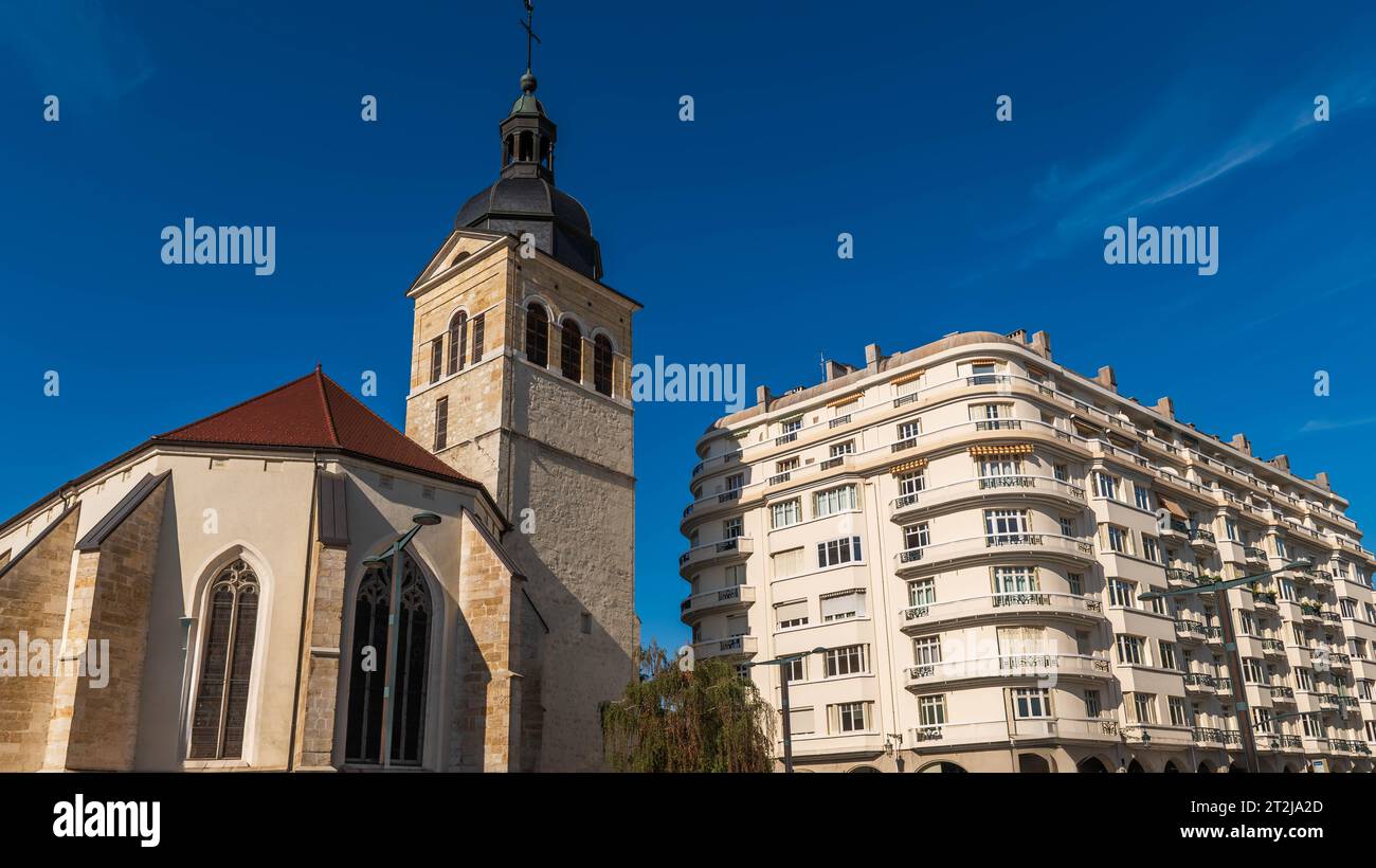 Rear of the Saint Maurice church and its bell tower, and a residence, in Annecy, Haute Savoie, France Stock Photo