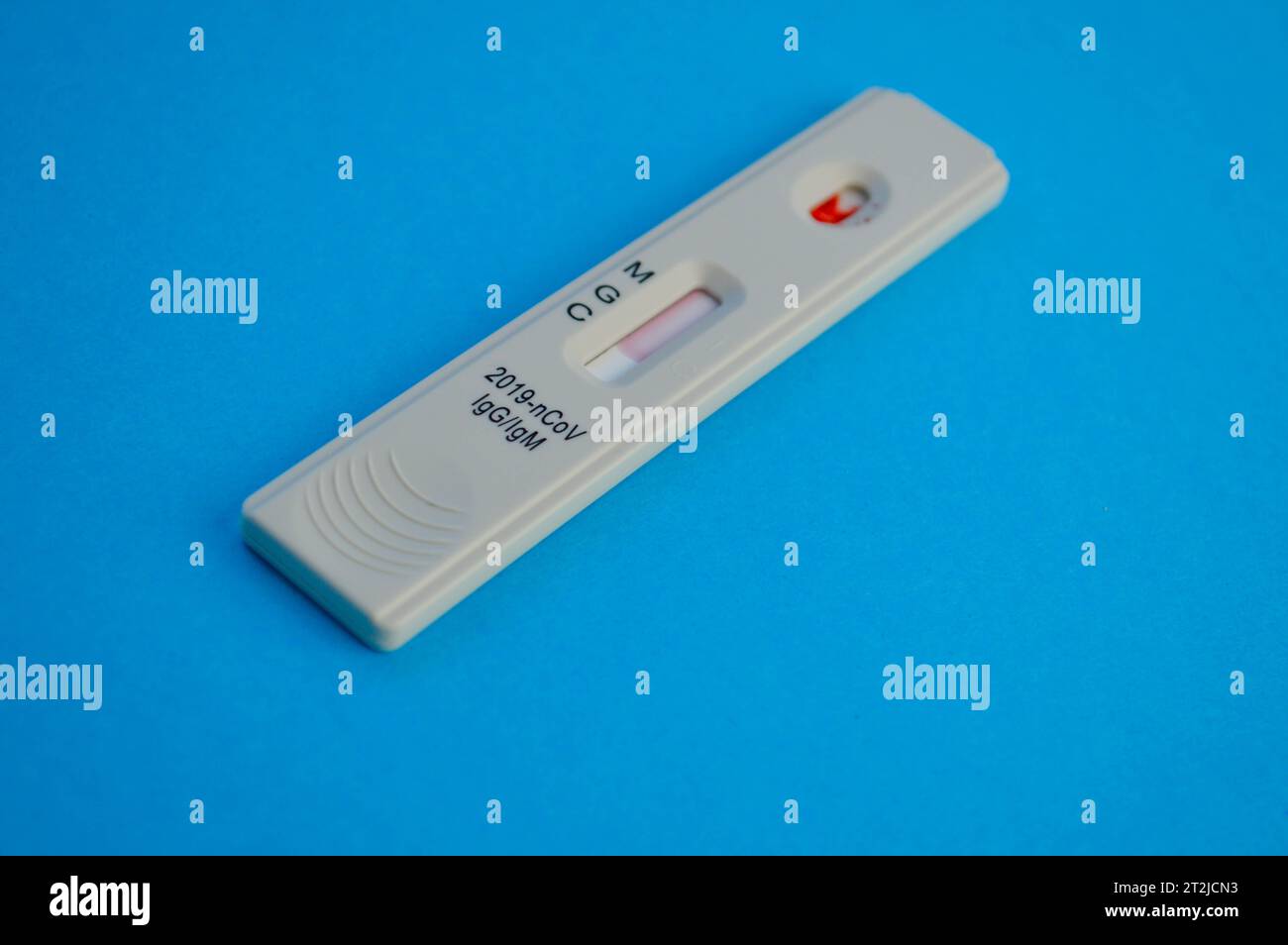 coronavirus test lies on a blue background. a drop of venous blood on ...