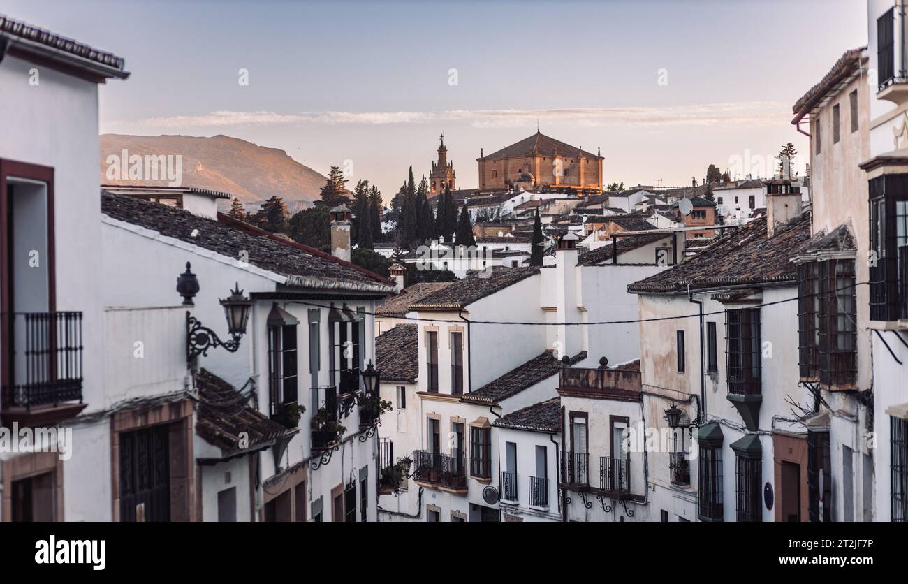 Views of the medieval village of Ronda with white Andalusian houses and the gothic style church of Santuario de Mar a Auxiliadora. Malaga, Spain Stock Photo