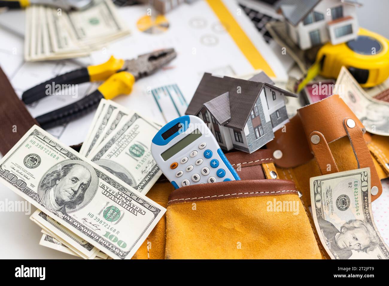 Working on construction project background. Office table with dollars and pen Stock Photo