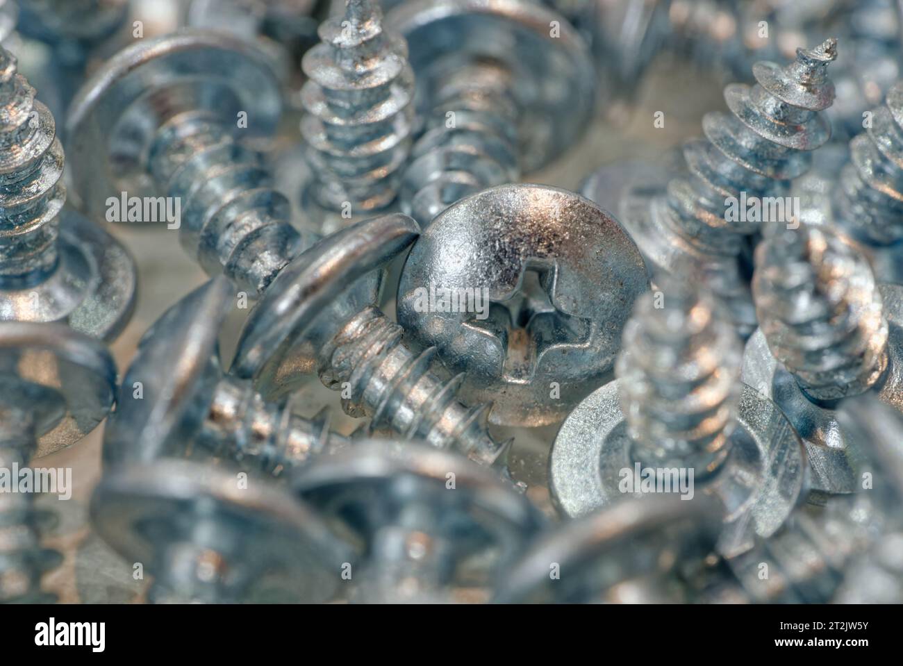 Random pile of galvanized screws, abstract industrial background Stock ...