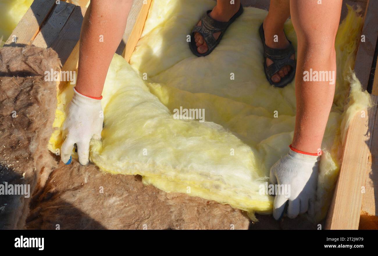 Attic roof construction with fiberglass insulation for energy saving