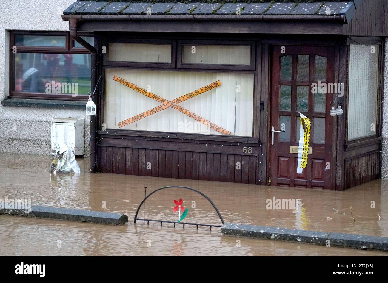 Tape marks a property in Brechin, Scotland, as Storm Babet batters the