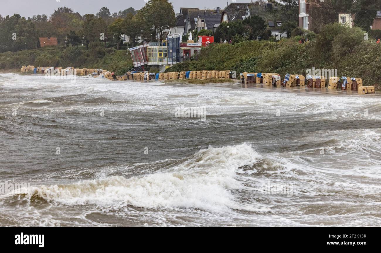 Kiel, Germany. 20th Oct, 2023. Baltic Sea waves flood the beach chairs