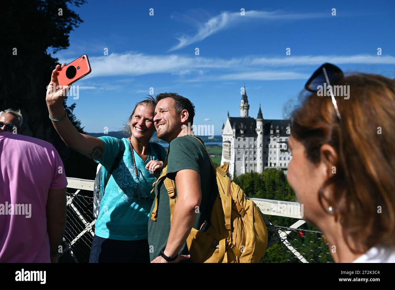 Tourists take a selfie with Neuschwanstein Castle in the Bavarian Allgäu near Füssen, Germany Stock Photo