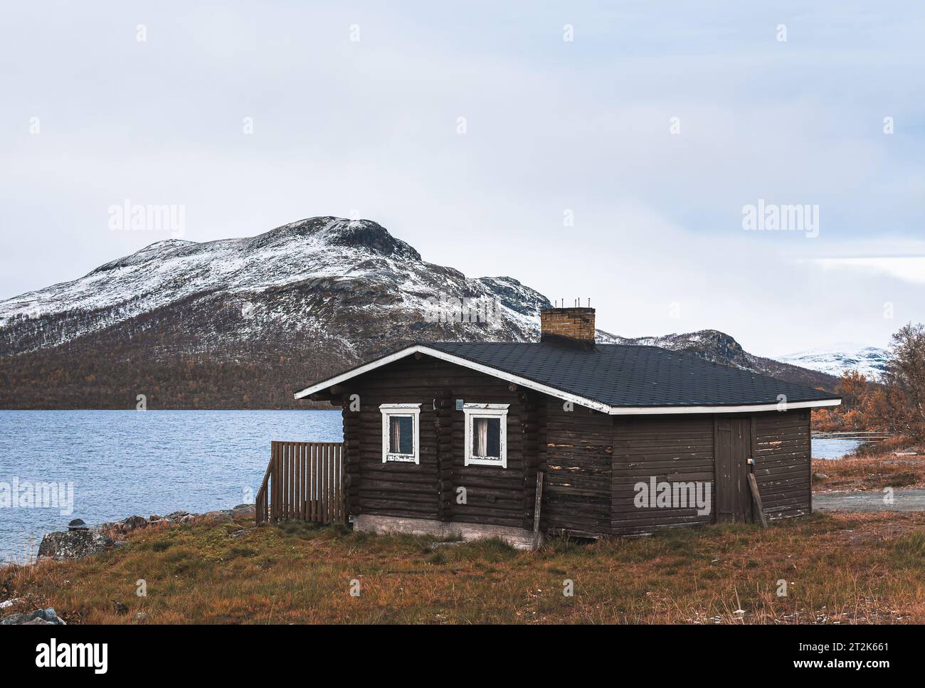 Wooden house on the coast of lake in Finland, Lapland Stock Photo