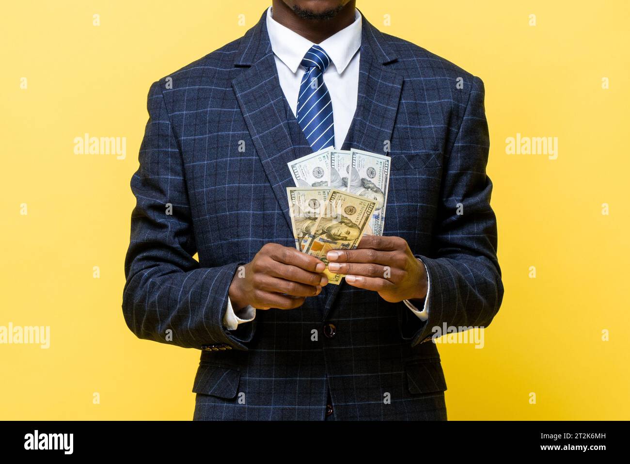 African man in business suit holding money Stock Photo