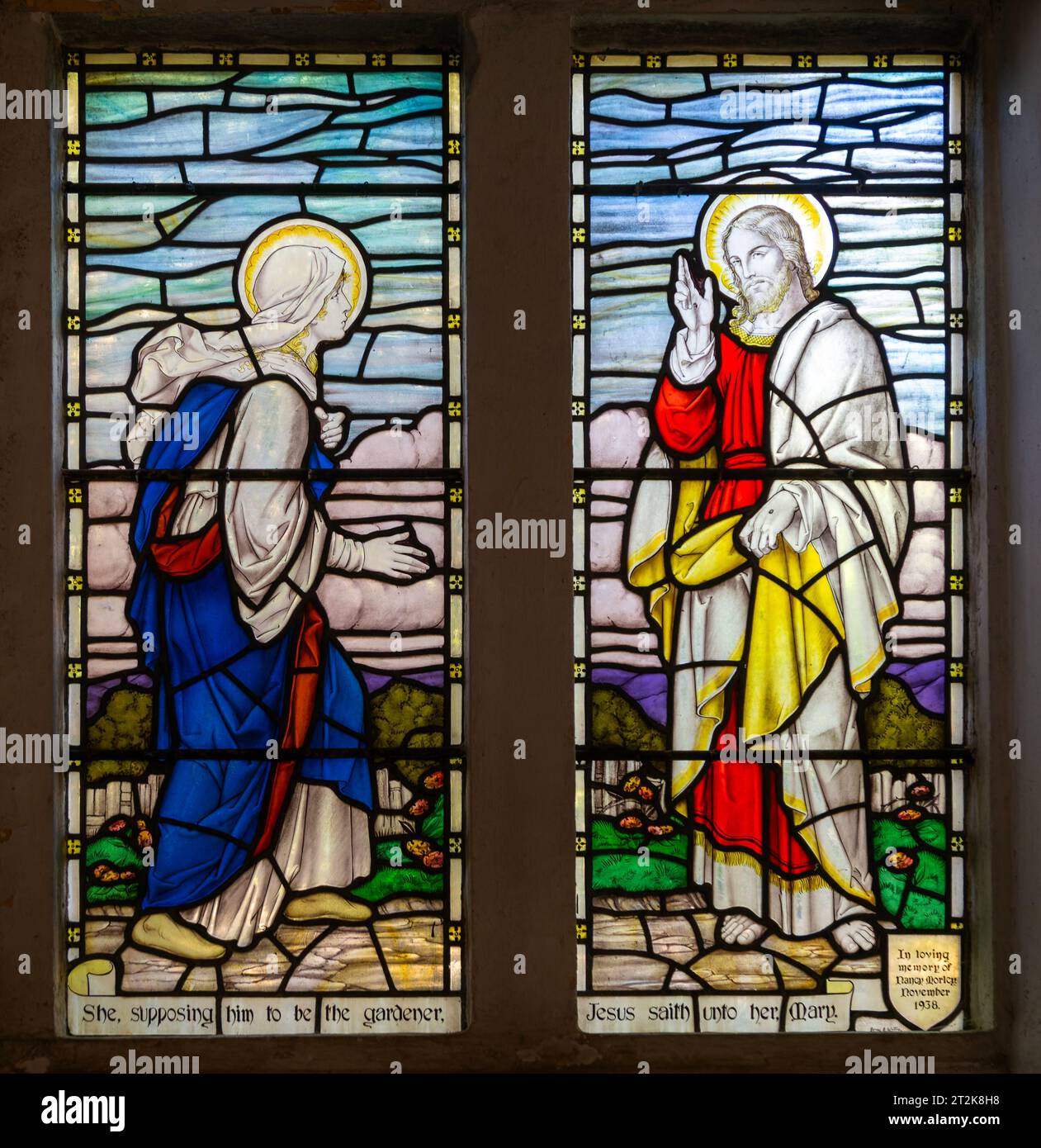 Stained glass window of Jesus and Mary Magdalene 1930s, church of Saint Nicholas, Biddestone, Wiltshire, England, UK Stock Photo